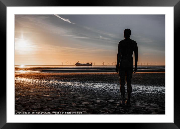 A lonely figure stands guard over the shipping Framed Mounted Print by Paul Hanley