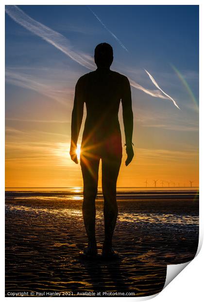 A lonely figure stands silent on Crosby beach Print by Paul Hanley