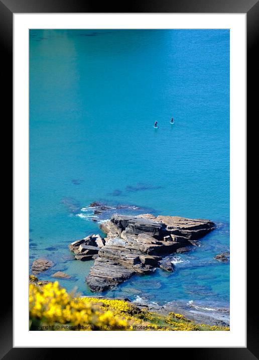 Two paddle boarders on the cornish coastline in pe Framed Mounted Print by Peter Barber