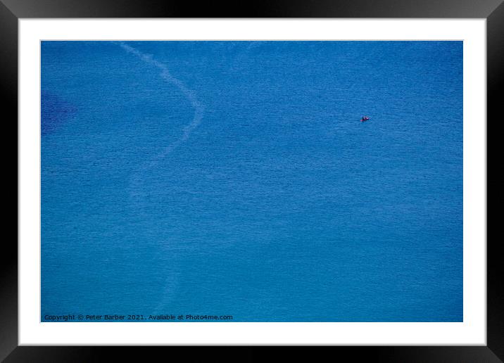 A canoe on the clean blue water of Trebarwith Strand. Framed Mounted Print by Peter Barber