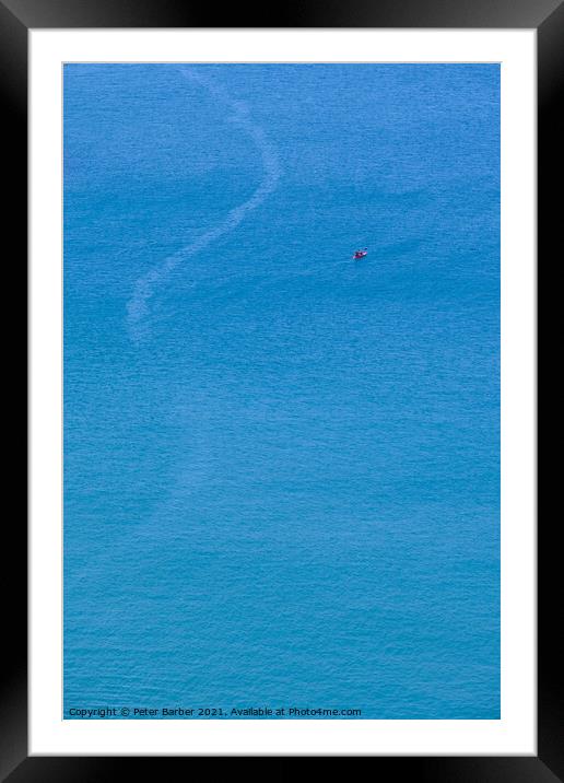A canoe on the clean blue water of Trebarwith Strand. Framed Mounted Print by Peter Barber