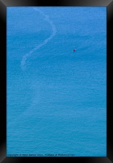A canoe on the clean blue water of Trebarwith Strand. Framed Print by Peter Barber