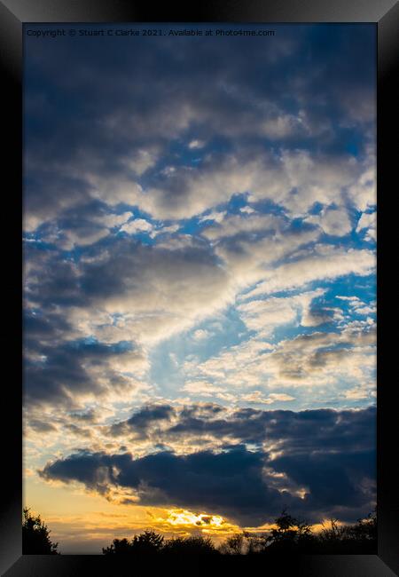 Cloudy sunset Framed Print by Stuart C Clarke