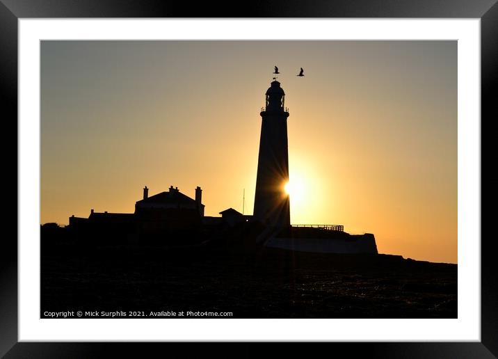 Sunrise biting a chunk out of St Marys Lighthouse Framed Mounted Print by Mick Surphlis