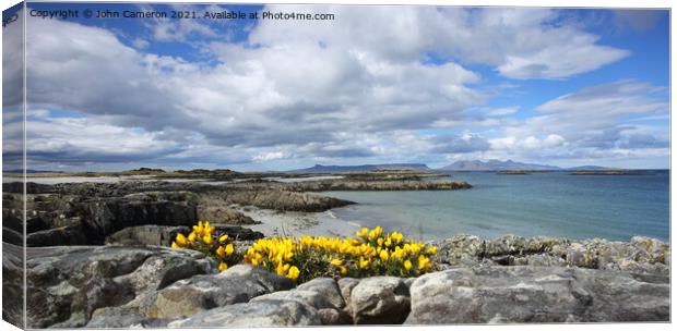 Isles of Eigg and Rum from Traigh in Arisaig. Canvas Print by John Cameron