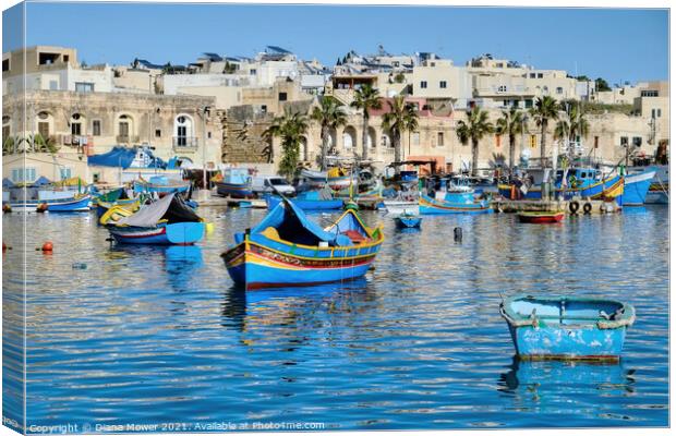 Marsaxlokk Harbour and Village Malta Canvas Print by Diana Mower