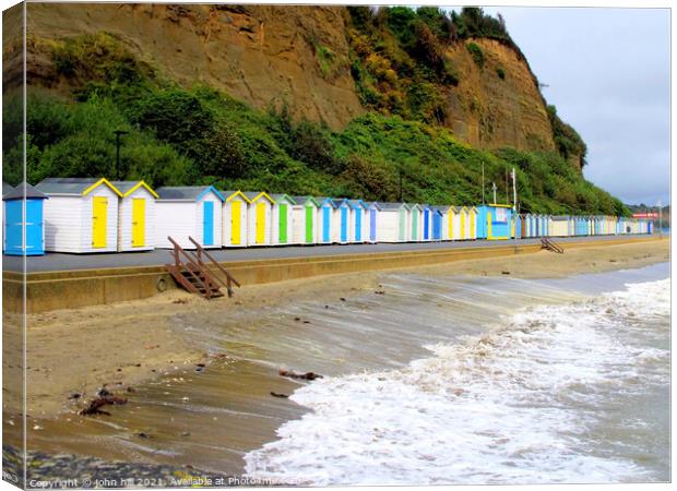 Beach huts on Hope beach at Shanklin on the IOW. Canvas Print by john hill