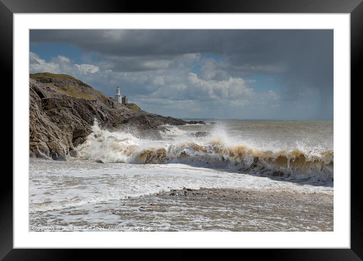 Mumbles lighthouse breaking wave Framed Mounted Print by Bryn Morgan