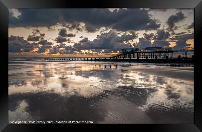 Sunrise Reflections on Cromer Beach North Norfolk  Framed Print by David Powley