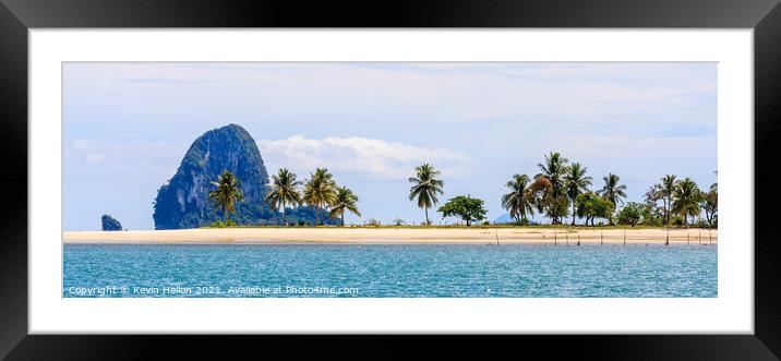 Palm trees on a sandy spit Framed Mounted Print by Kevin Hellon