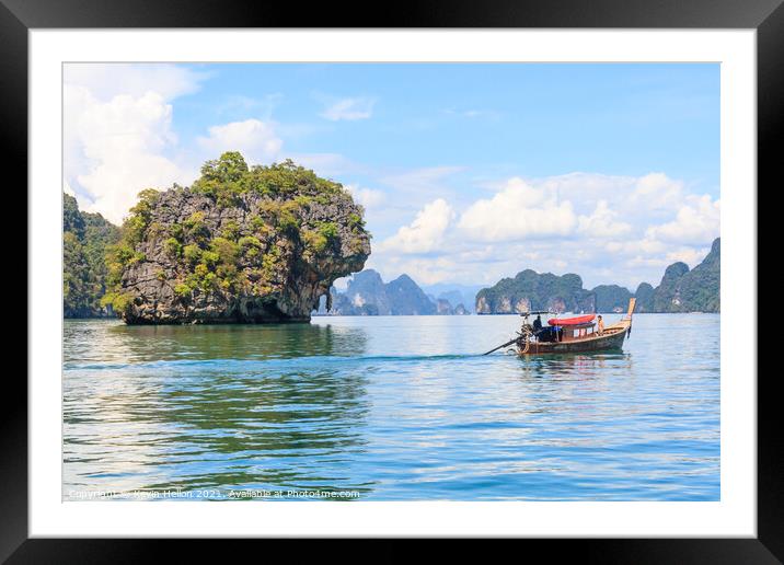 Tourists in a long tail boat Framed Mounted Print by Kevin Hellon