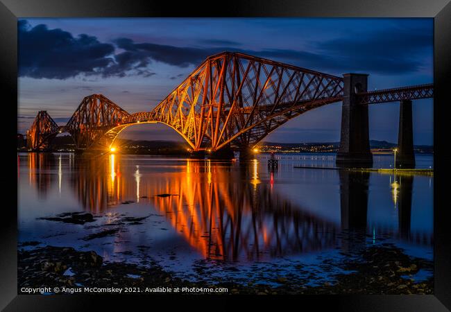 Floodlit Forth Rail Bridge at dusk Framed Print by Angus McComiskey