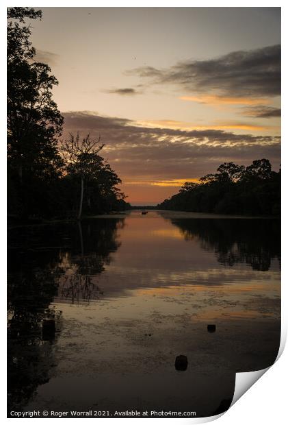 A sunset over a body of water Print by Roger Worrall