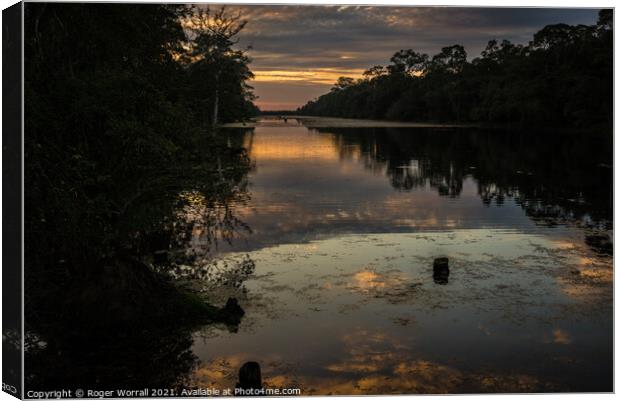 Sunset Reflection Canvas Print by Roger Worrall