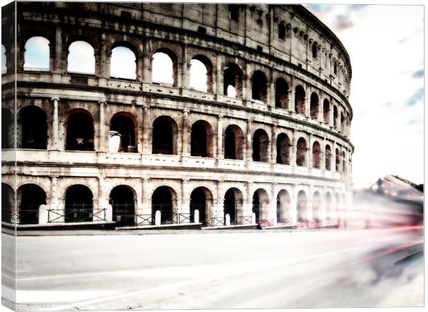 Traffic Flow Around The Colosseum In Rome, Italy Canvas Print by Peter Greenway