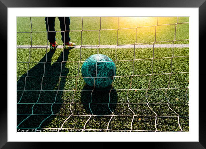 Soccer ball entering a goal defended by a goalkeeper, copy space Framed Mounted Print by Joaquin Corbalan