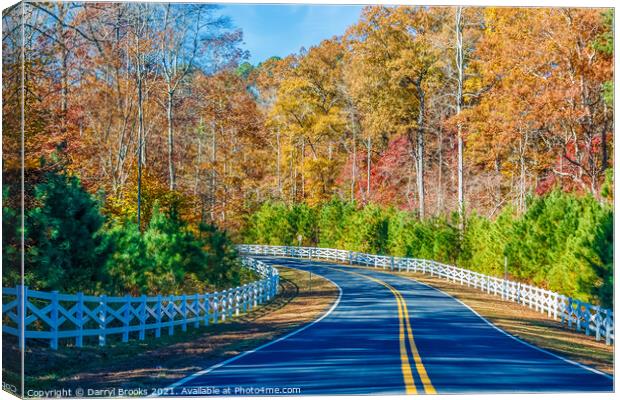Road Curving Through Autumn Trees and White Fence Canvas Print by Darryl Brooks