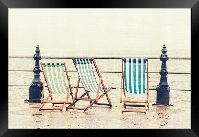Deckchairs In The Rain At Torquay Framed Print by Peter Greenway