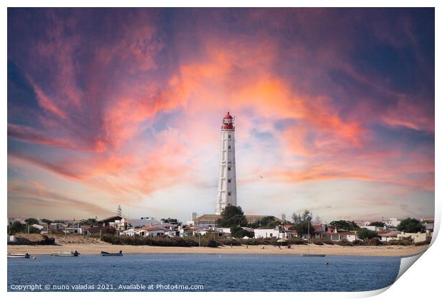 Beautiful lighthouse overlooking the ocean at suns Print by nuno valadas