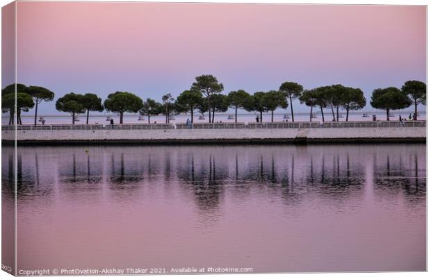 Beautiful twilight pink and blue sunset sky and a boardwalk on Tagus River. Canvas Print by PhotOvation-Akshay Thaker