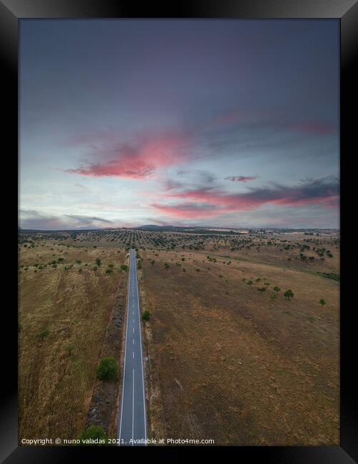 Aerial view of a country road in spring at the sunset Framed Print by nuno valadas