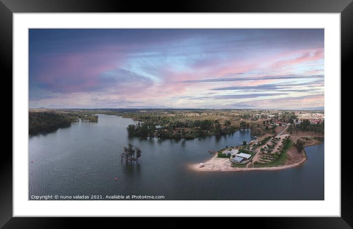 Aerial view from a lake with a beach at the sunset. Framed Mounted Print by nuno valadas