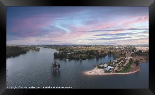 Aerial view from a lake with a beach at the sunset. Framed Print by nuno valadas