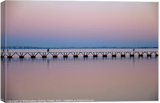 Beautiful twilight pink and blue sunset sky and a boardwalk on Tagus River. Canvas Print by PhotOvation-Akshay Thaker