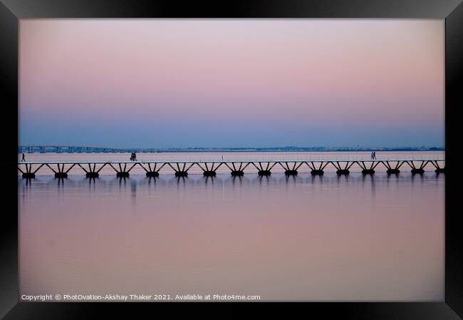 Beautiful twilight pink and blue sunset sky and a boardwalk on Tagus River. Framed Print by PhotOvation-Akshay Thaker