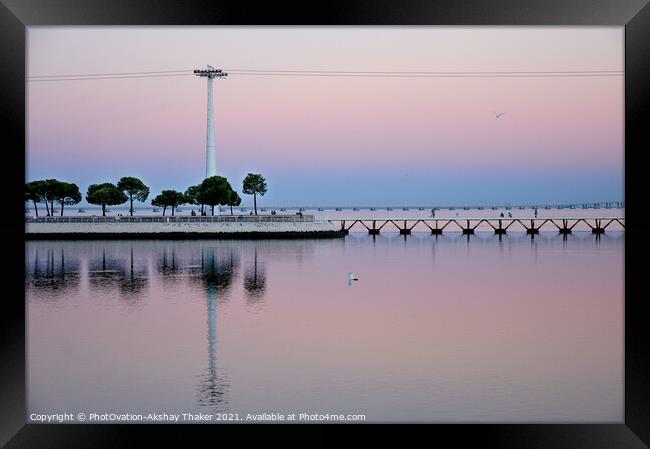 Beautiful twilight pink and blue sunset sky and a boardwalk on Tagus River. Framed Print by PhotOvation-Akshay Thaker