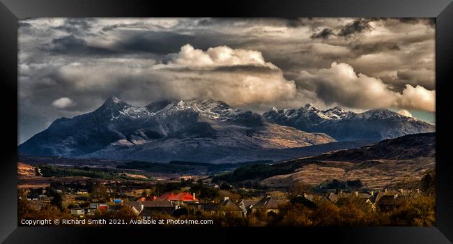 The dramatic Black Cuillin Hills beyond Portree. Framed Print by Richard Smith