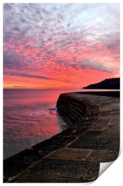 Fiery sunset over the Cobb in Lyme Regis Print by Love Lyme Regis