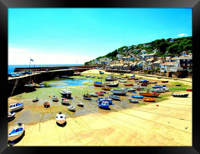 Mousehole harbour at low tide in Cornwall Framed Print by john hill