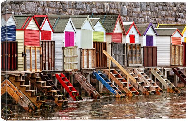 Colourful Beach Huts Canvas Print by Anthony Michael 