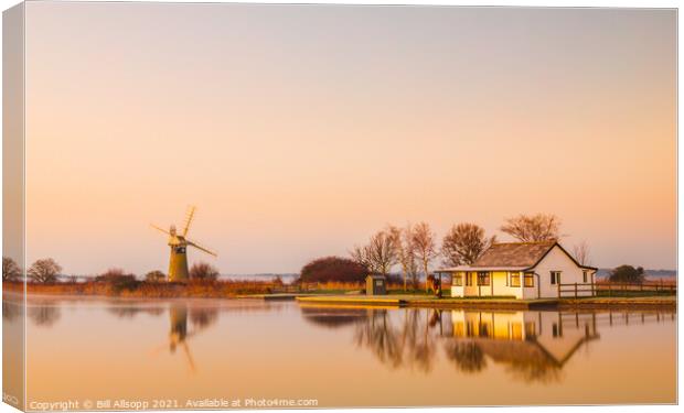 Golden dawn at Thurne with St. Benets Mill. Canvas Print by Bill Allsopp