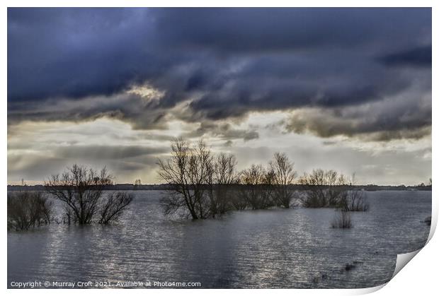 Turbulent skies over Welches Dam, Cambridgeshire Print by Murray Croft