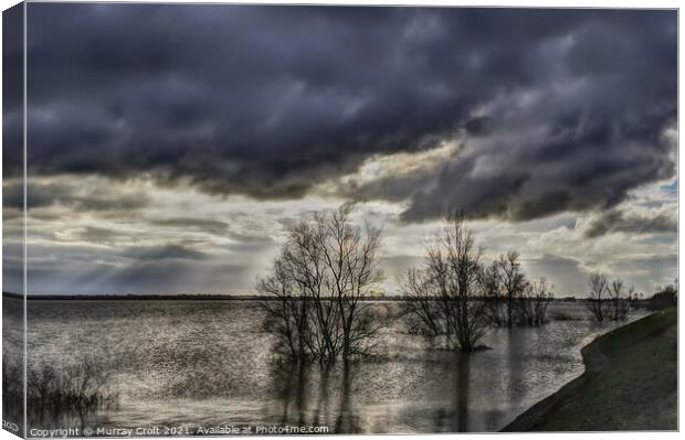 Turbulent skies over Welches Dam, Cambridgeshire Canvas Print by Murray Croft