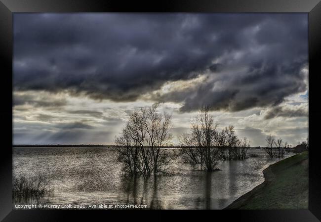 Turbulent skies over Welches Dam, Cambridgeshire Framed Print by Murray Croft