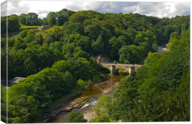 Green Bridge over the river Swale in Richmond North Yorkshire UK  Canvas Print by Peter Jordan