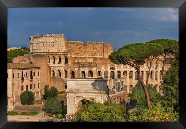 Colosseum and Arch of Titus in Rome Framed Print by Artur Bogacki
