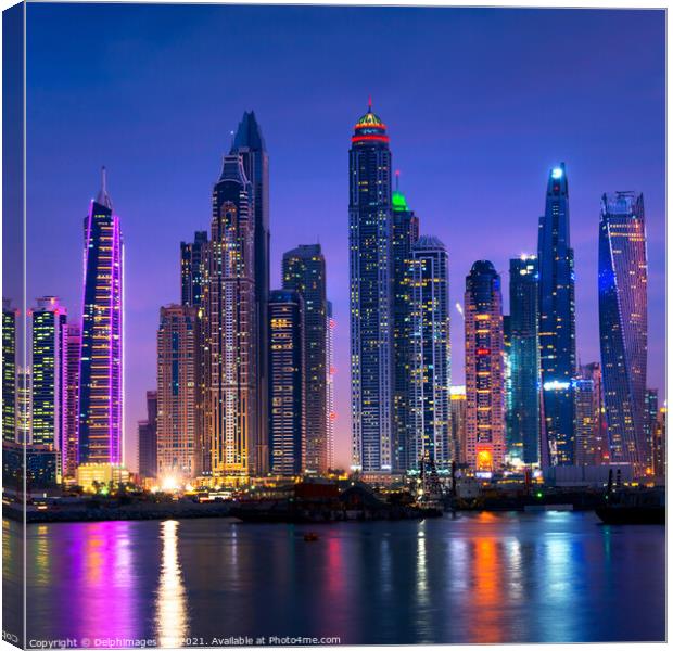 Dubai marina skyline illuminated at night, UAE Canvas Print by Delphimages Art