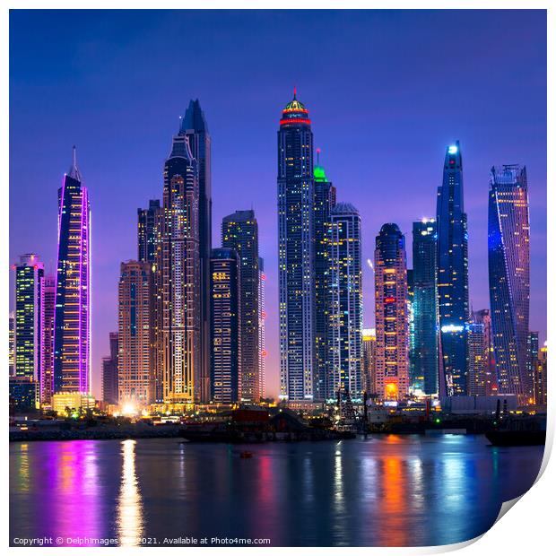 Dubai marina skyline illuminated at night, UAE Print by Delphimages Art