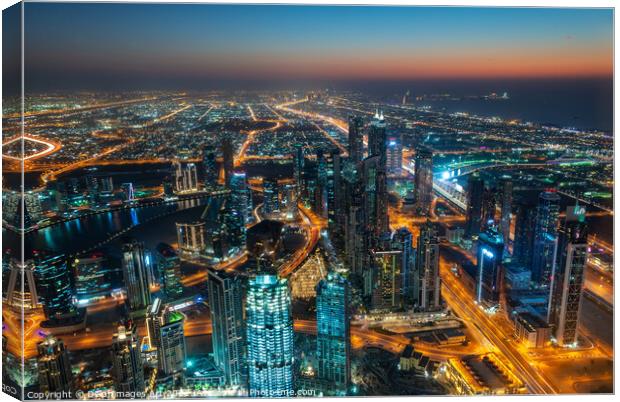 Dubai, city view from Burj Khalifa tower at night Canvas Print by Delphimages Art