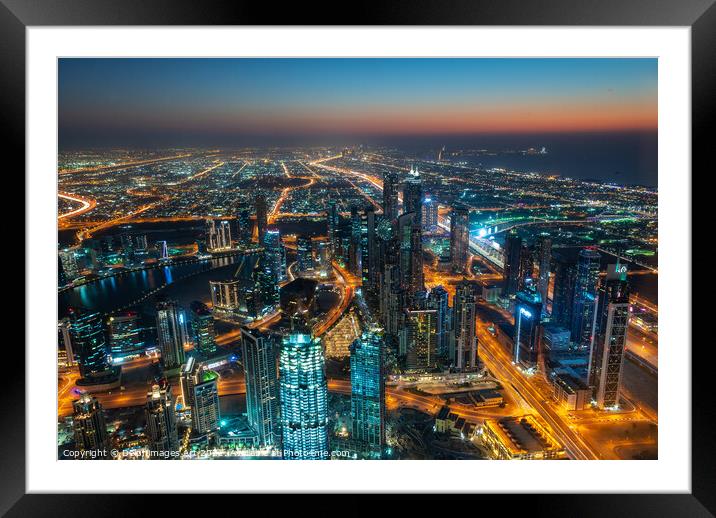 Dubai, city view from Burj Khalifa tower at night Framed Mounted Print by Delphimages Art