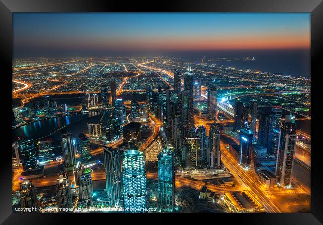Dubai, city view from Burj Khalifa tower at night Framed Print by Delphimages Art