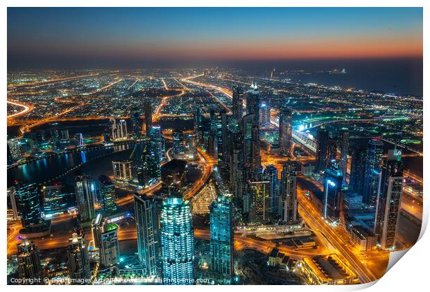 Dubai, city view from Burj Khalifa tower at night Print by Delphimages Art