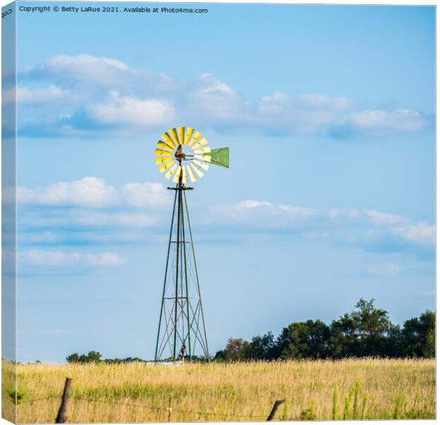 Windmill Against Blue Sky Canvas Print by Betty LaRue