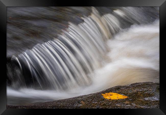 Abstract water flowing in a river Framed Print by Martin Williams