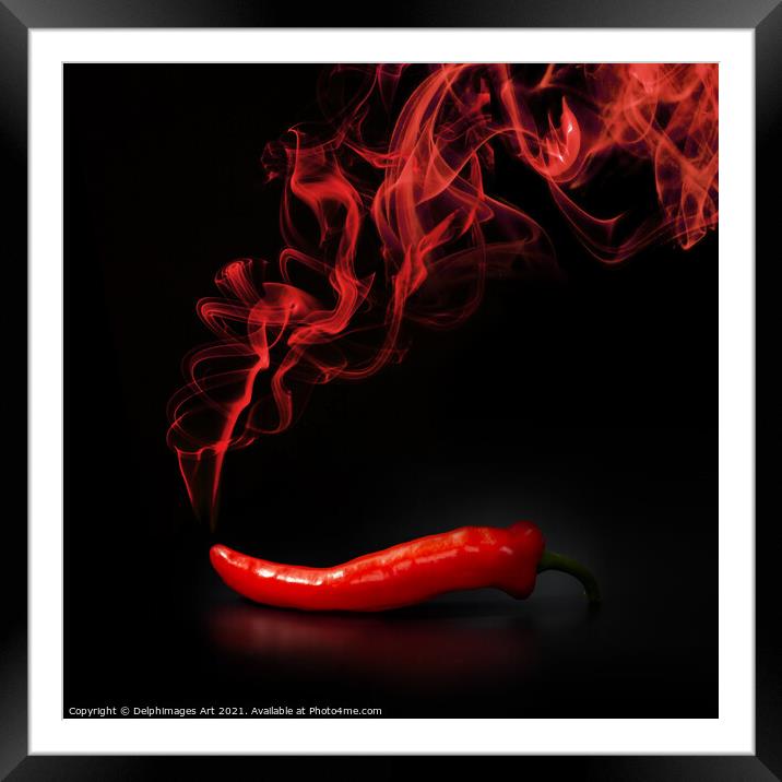 Hot smoking red chili pepper on black background Framed Mounted Print by Delphimages Art