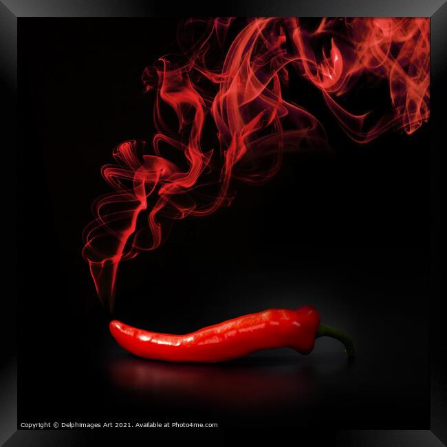 Hot smoking red chili pepper on black background Framed Print by Delphimages Art